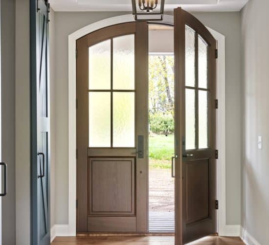 Entryway with double wood doors