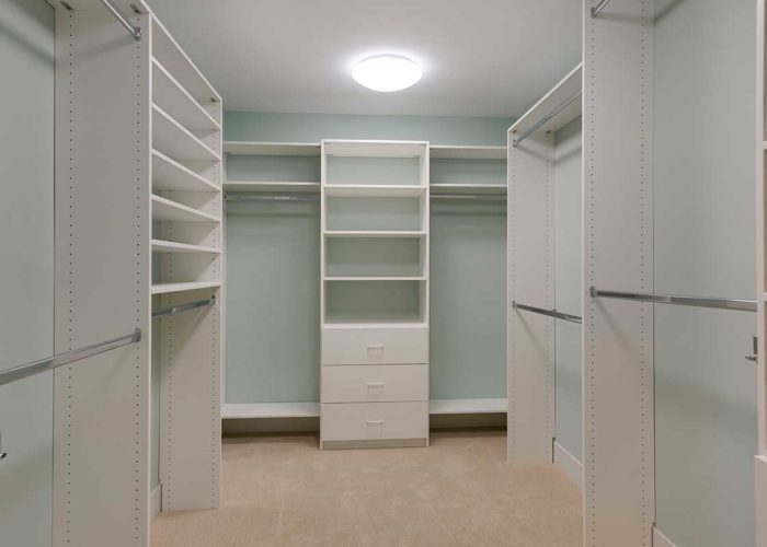 Large walk in closet with storage
