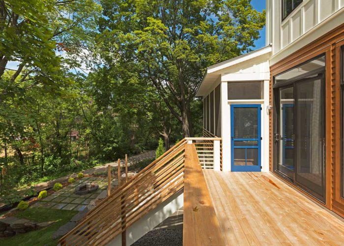 Light wood deck with blue door