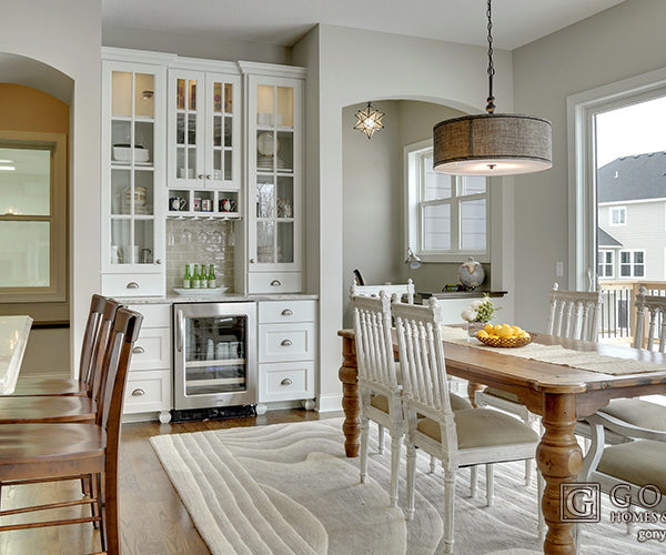 Rustic home dinette with white cabinets