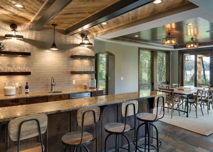 Basement bar area with exposed beam ceiling