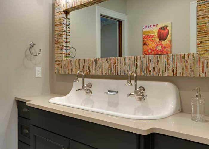 Double sink in bathroom with unique mirror