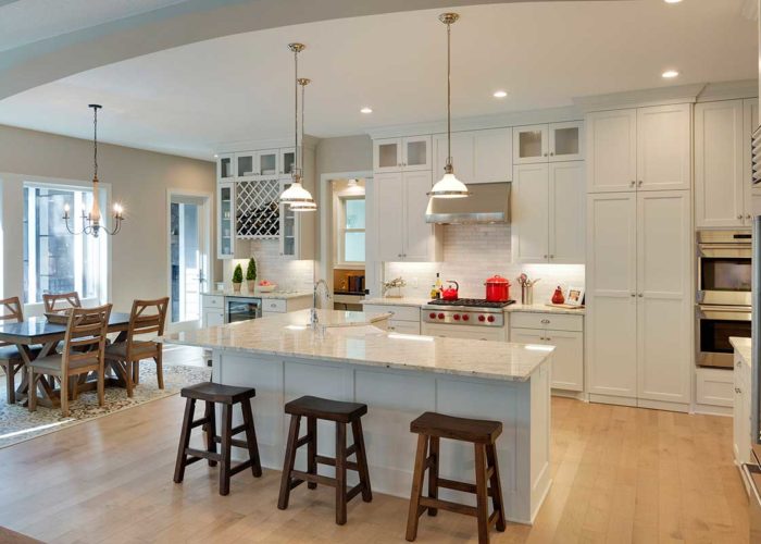 Modern white kitchen with seating at center island