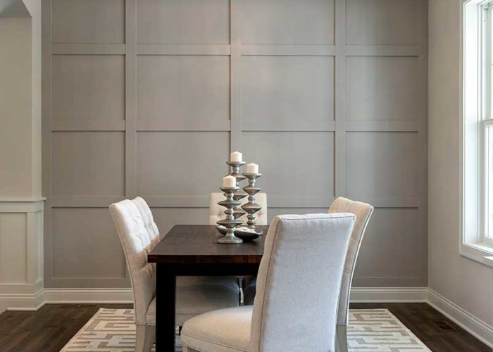 Cozy dining room table with grey accent wall