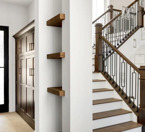 view of entry with built-ins and grand staircase