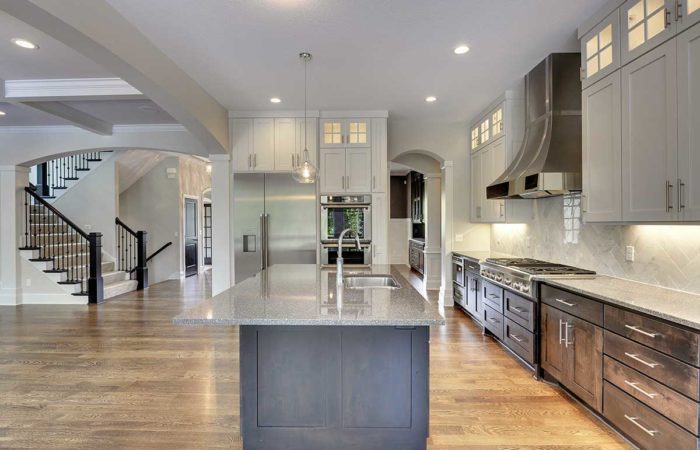 Kitchen with large island and white cabinets
