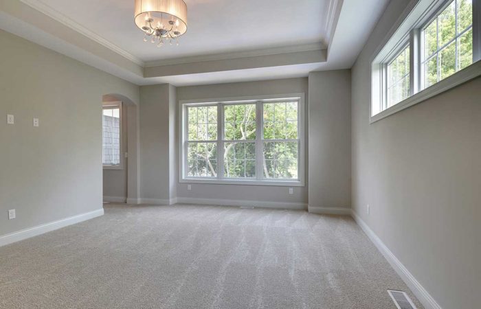 Neutral living space with large windows
