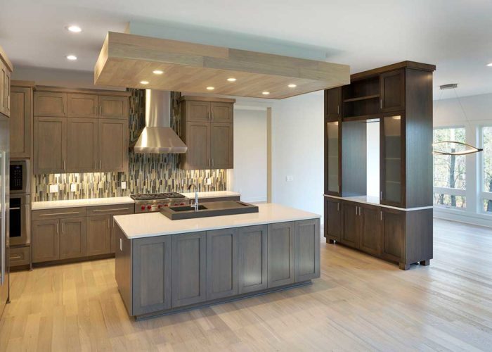 Modern kitchen with recessed lighting above center island
