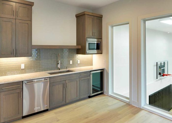 Kitchen space with windows overlooking sport court