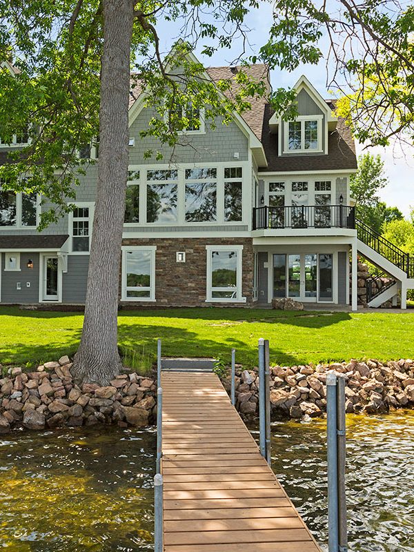 Waterfront luxury home in minnesota picture taken from dock on lake