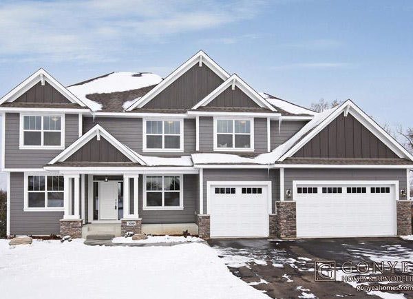 Dark grey exterior of home during winter