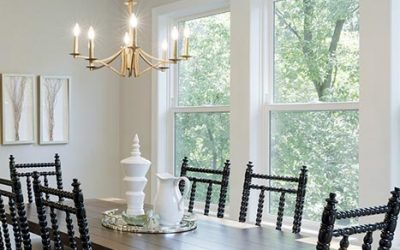 White dining room with brass accents