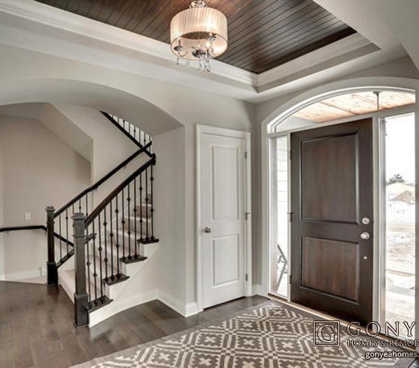 Neutral entry way of home with coat closet