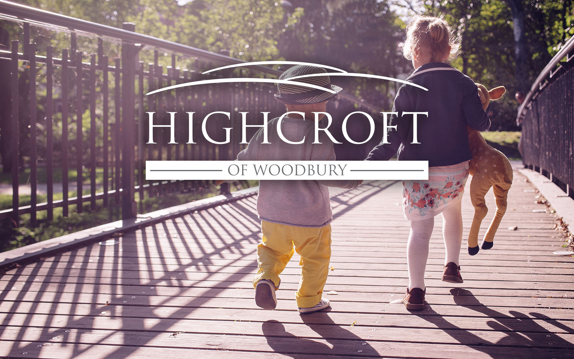 Highcroft of Woodbury logo on top of photo of children walking