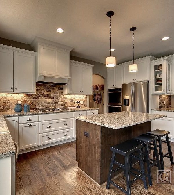 Spacious kitchen with white cabinets