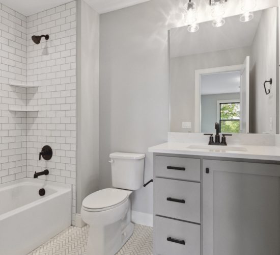 Bathroom with titled shower and tub