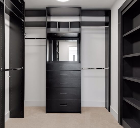 owners walk-in closet with black shelving