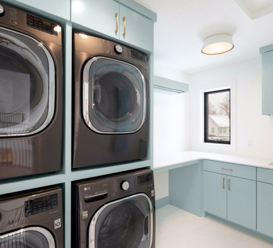 laundry room with blue cabinets