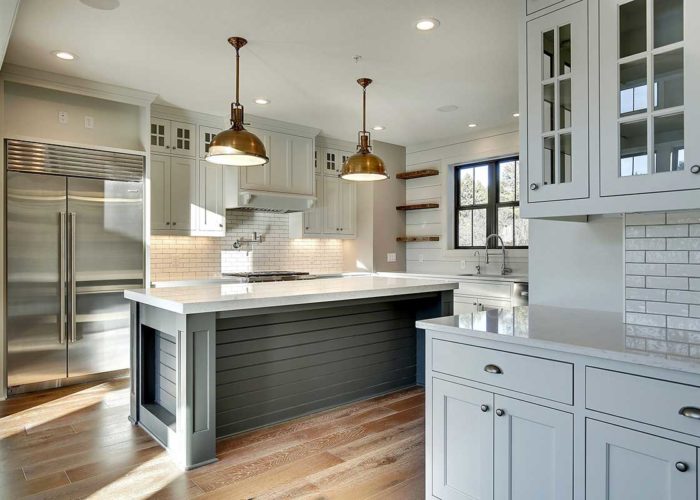 Neutral kitchen with copper lighting