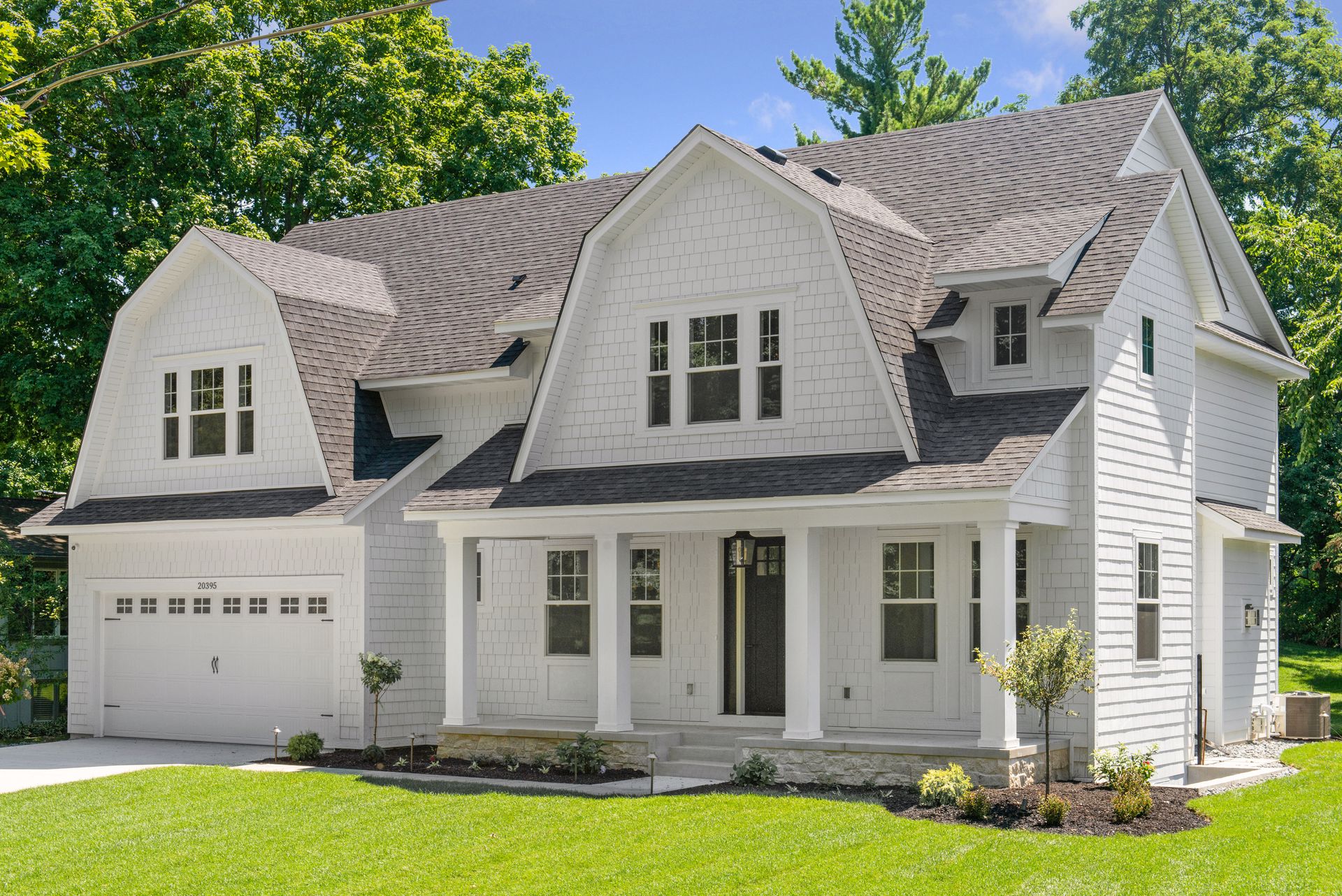 exterior of white dutch colonial home