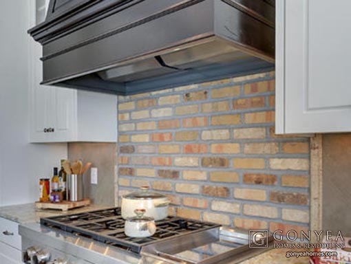 Rustic brick kitchen backsplash